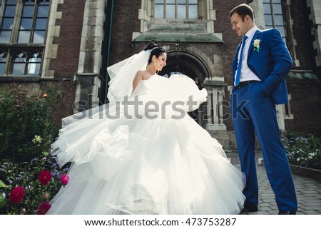 groom admiring his  incredible wife