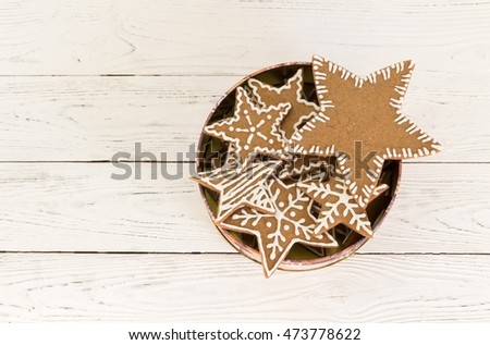Gingerbread cookies  in a gift box on a white wooden background. Christmas concept. Bakery concept