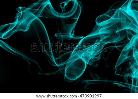 Blue smoke on black background, movement of white smoke
