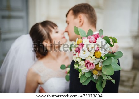 Bride and groom at wedding Day. Wedding photo session in interior. Bridal couple, Happy Newlywed woman and man embracing. Romantic wedding.