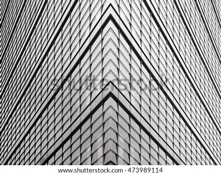 Sharp corner of a modern office building with all-over glazing. Reworked hi-tech architecture photograph.