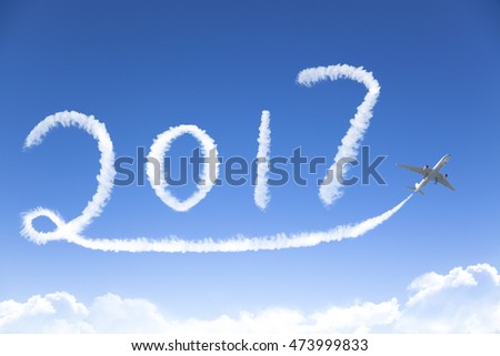happy New year 2017 drawing by airplane in the sky Royalty-Free Stock Photo #473999833