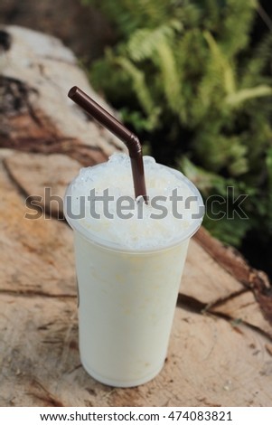 iced milk is delicious on wood background