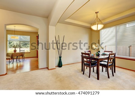 Open floor plan Dining room interior in creamy tones of luxury house. Northwest, USA
