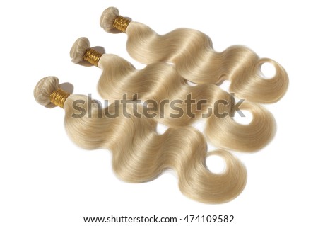 blonde virgin body wave human hair weave extensions Royalty-Free Stock Photo #474109582