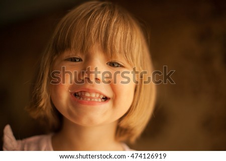 Cheerful smile of the lovely baby girl