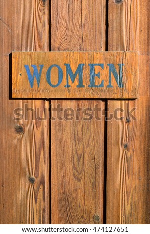 Sign of womens bathroom door
