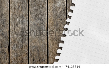 Notebook paper sheet on a wooden table