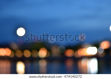 bokeh night light of background in riverside.