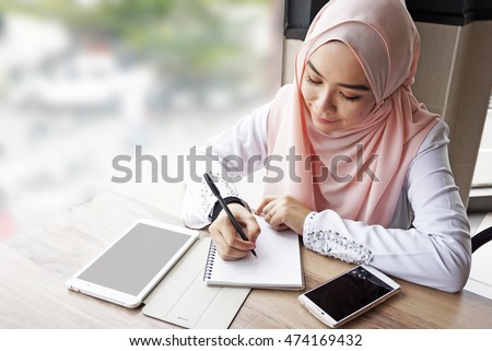 muslim woman working. 