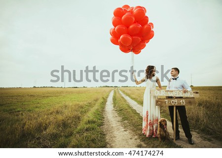 loving young couple spend funny time in the field