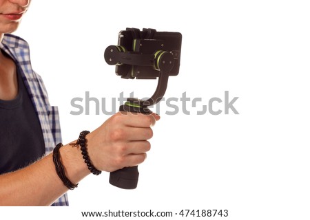 Innovative digital camera is a new generation with electronic stabilizer. Isolated on white. Royalty-Free Stock Photo #474188743