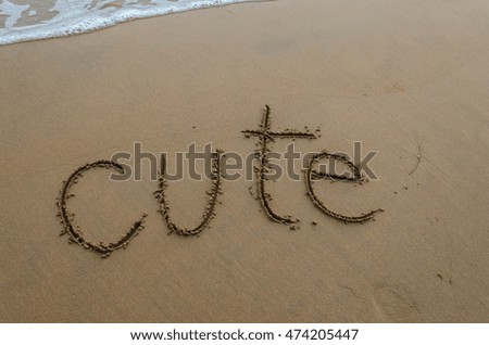 cute. message on the beach. Alphabet handwritten in sand on beach. vacation and travel concept. background.