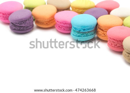 Colorful mini macaroons isolated on white background
