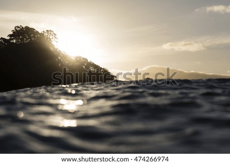Sunset From The Sea/ an image taken from the water looking back into the beach at dusk 