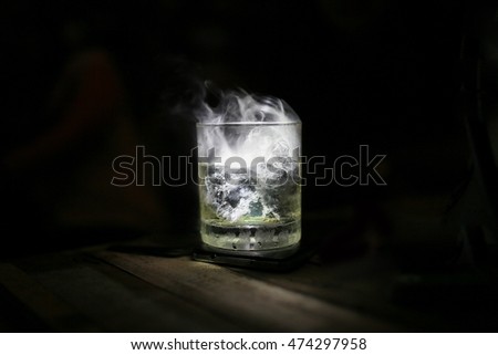 drink in glass with the effect of dry ice

