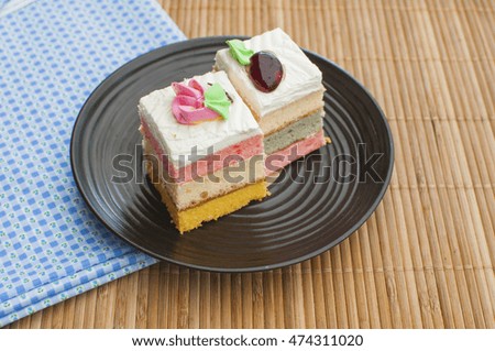 Colorful sweet cakes slices pieces.