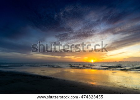 beautiful beach in the morning with clouds and reflection