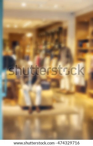 Blur urban marketplaces store during the final seasonal sale of fashion goods. Shopping hall supermarket as a universal background blur for any theme of design sales