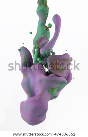 A macro shot of ink Colors mixing under water forming interesting accidental liquid sculptures. Isolated on white background.
