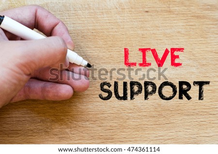 Live support text concept with human hand over wooden background