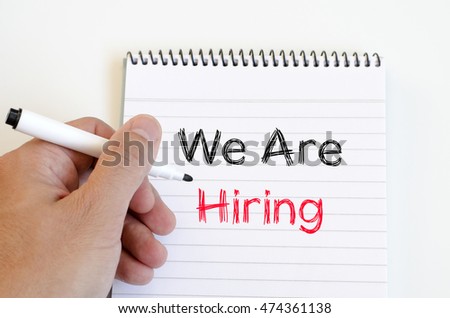 We are hiring text concept on notebook over white background
