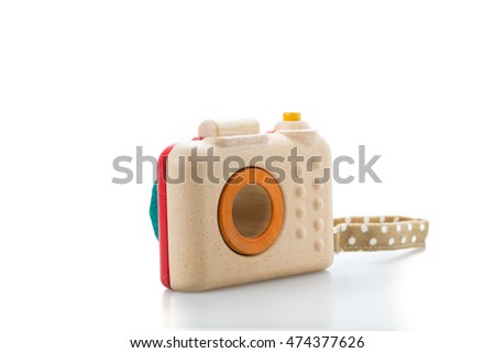 wooden toy camera on white background.