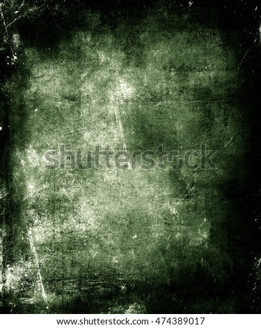 Dark Scratched Green Grunge Abstract Texture Background. Scary halloween poster with faded central area for your text or picture