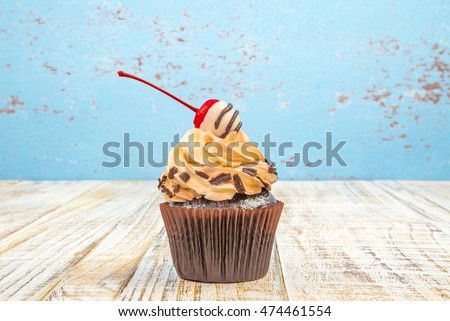 Chocolate Cupcakes on wood vintage background
