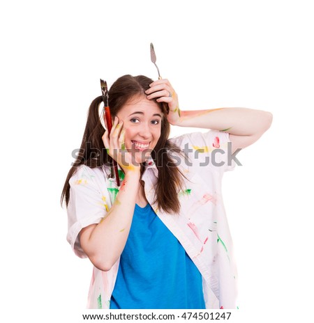 young artist paints a woman and posing on a white background