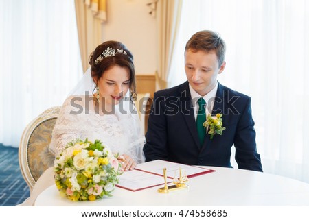 Young happy bride and groom on their wedding. Marriage concept