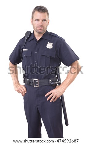 Handsome Caucasian police officer wearing cop uniform stands with authority and bold eyes on white background