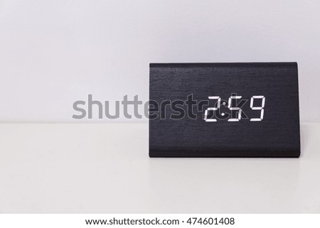 Black digital clock on a white background showing time 2:59 (two hours fifty-nine minutes)