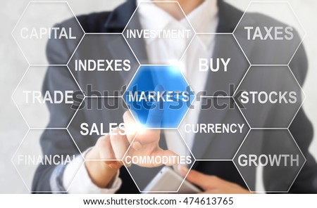 Businesswoman presses markets hexagon button on virtual screen. Businessman touching icon market on touch screen. Forex, business. Indexes, trade, stock, currency, commodities, finance concept.