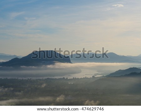fog above the river  and big monutain with sunrise from thailand
