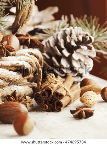 Christmas card with fir branches, tangerines, pine cones, and decoration elements , selective focus
