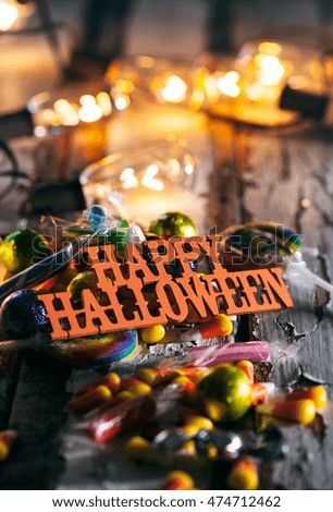Halloween: Happy Halloween With Candy And Glowing Bulbs