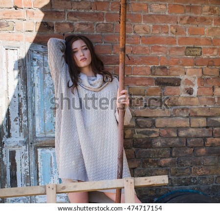 Portrait of beautiful young woman with makeup in fashion clothes 