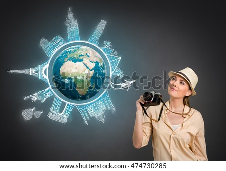 
concept travel around the world, tourist with photo camera. Elements of this image are furnished by NASA