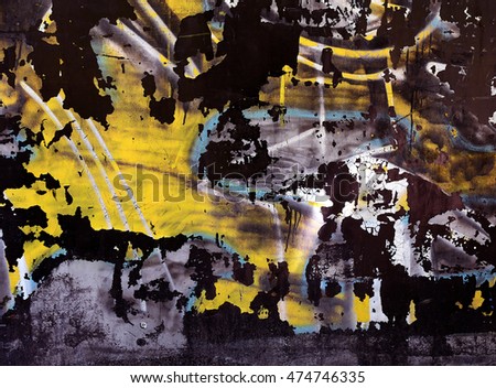 Paineted colorful texture on black wall with blue, yellow, white colors