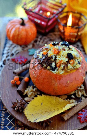 Pumpkin risotto made of rice with saffron and dried fruits