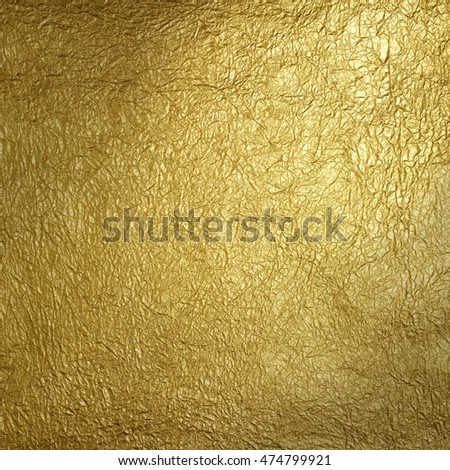 Wrinkled golden surface pattern. Christmas background.