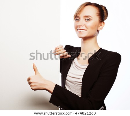 Happy smiling young business woman showing blank signboard, over white  background