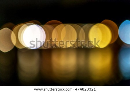 Abstract blur of bright lights lamps stage summer art cafe open area at seaside summer resort. Background for creative design greeting card. Restaurant, coffee shop with beautiful background blur