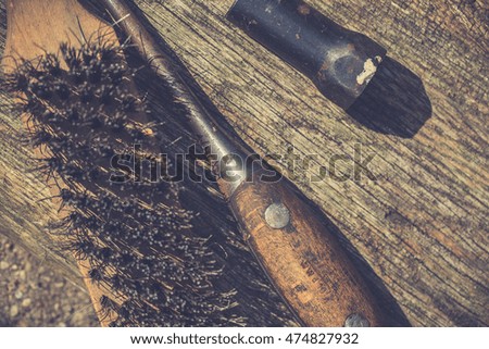 Old tools on old wooden background. vintage photo