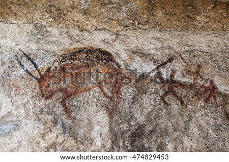 Wall cave with drawings of the primitive person.