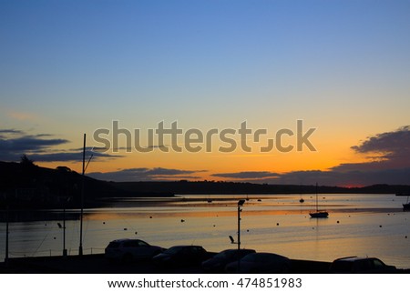 Sunrise over the Carrick Roads at high tide, Falmouth, Cornwall, England, UK.