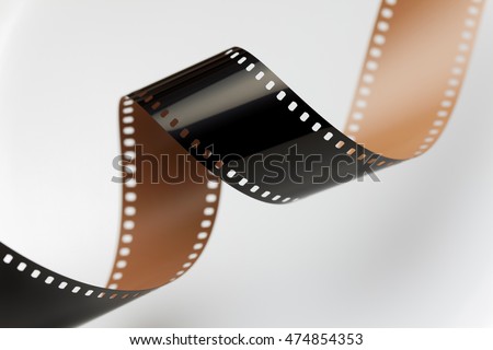 Camera negative film. Selective focus on film perforation. Unprocessed color motion picture film. Industry symbol for shooting process, photochemical laboratory process and film archive technology.