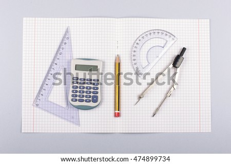 School accessories isolated on the gray background