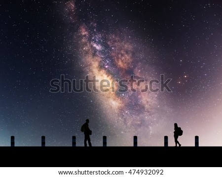 Galactic beautiful landscapes, travelers on the path that the Milky Way galaxy and the background light of the stars across the night sky.